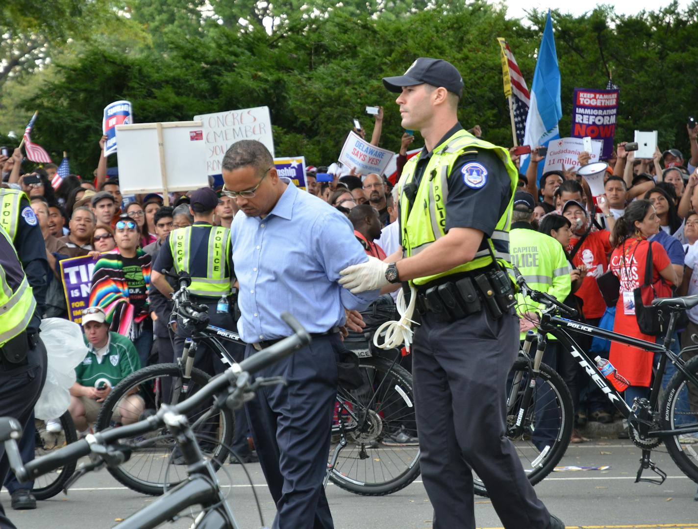 U.S. Rep. Keith Ellison was arrested Tuesday by U.S. Capitol Police during an immigration rally on the National Mall. As protestors marched toward the U.S. Capitol, Ellison and several other House Democrats sat in the middle of Independence Avenue, blocking rush hour traffic. Police led Ellison away in cuffs shortly after 4 p.m. Photo: Charlie Bruer / Special to the Star Tribune 10-08-2013 Washington, D.C.