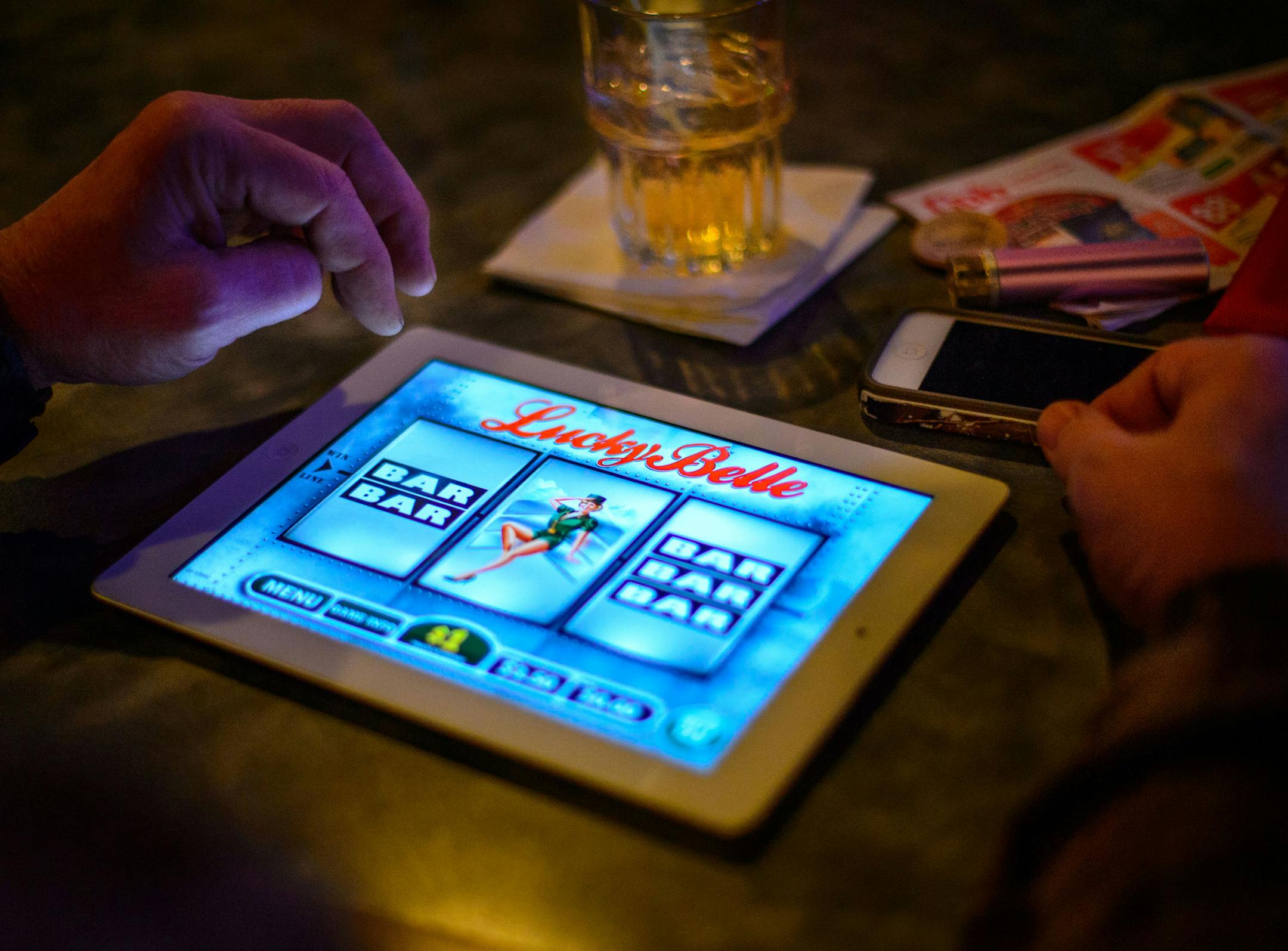 Marv Reynolds played an electronic pulltab game at CR's Sports Bar in Coon Rapids, Wednesday, February 5, 2014. He won, then lost $2.00. ] GLEN STUBBE * gstubbe@startribune.com