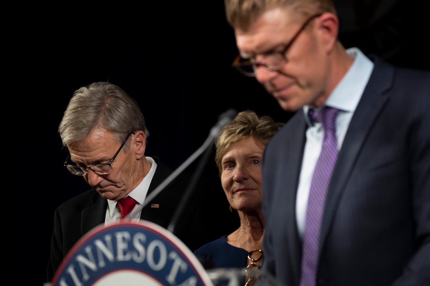 Republican gubernatorial candidate Scott Jensen bows his head as his running mate Matt Birk speaks as they concede the race to Gov. Tim Walz at the very end of the GOP election night party on Wednesday, Nov. 9, 2022 at the DoubleTree by Hilton Hotel in St. Louis Park, Minn. ] RENEE JONES SCHNEIDER • renee.jones@startribune.com