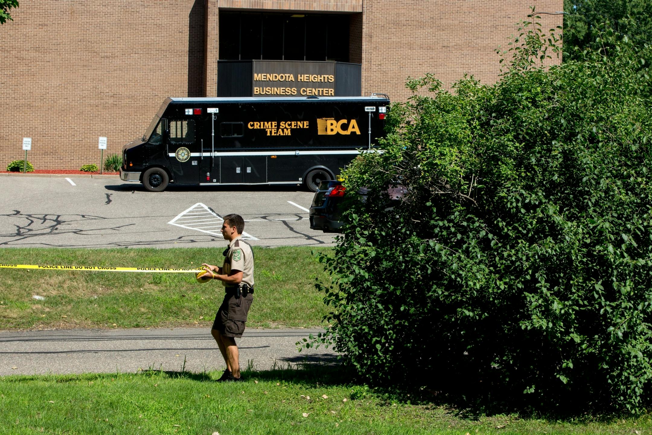 Police tape is placed following a death after an alleged armed robbery at Mendota Heights Business Center on July 29, 2017.