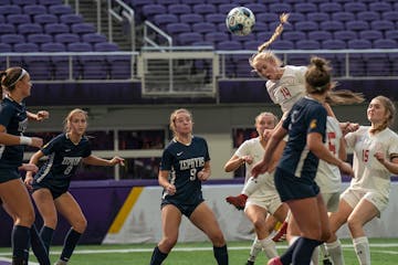 Siena Carver, of Benilde-St. Margaret's, tried to head the ball into the net on a corner kick.