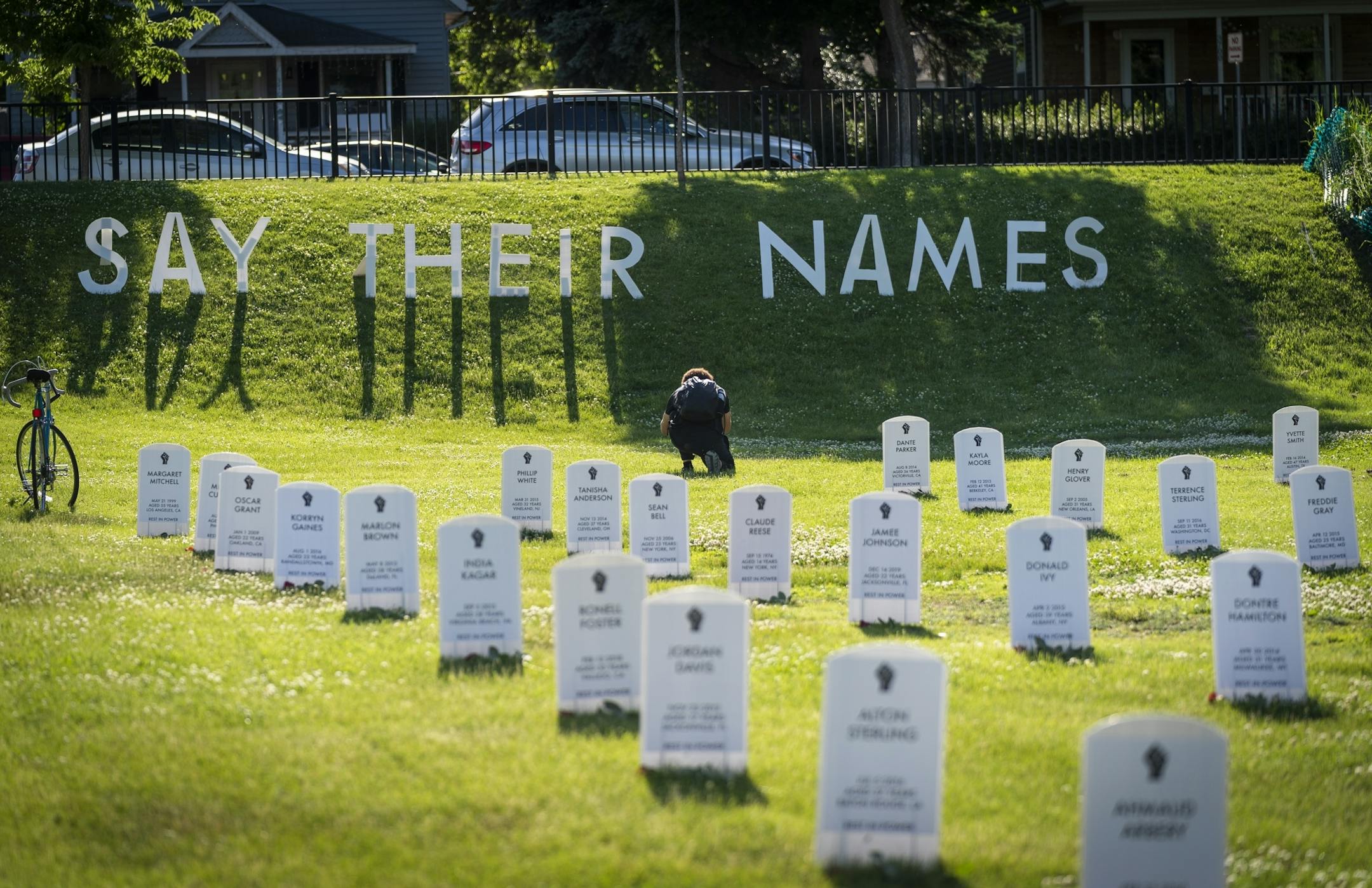 A field of grave markers was erected in a park near Cup Foods with the names of those killed by police.