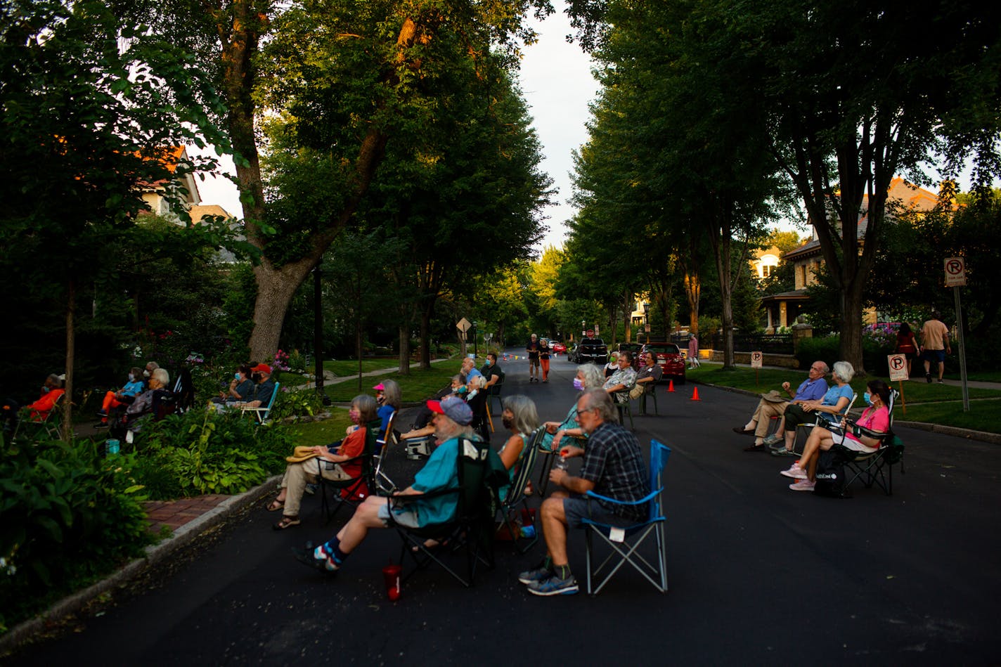 [A front yard performance by guitarist Pat Donohue of "Praire Home Companion" was hosted at Dick CohnÕs home in St. Paul Friday, August 7, 2020. NICOLE NERI ¥ Special to the Star Tribune] Audience members sat in lawn chairs in the street and on curbs and lawns to take in a front yard performance by guitarist Pat Donohue of "Praire Home Companion" at Dick CohnÕs home in St. Paul Friday, August 7, 2020.