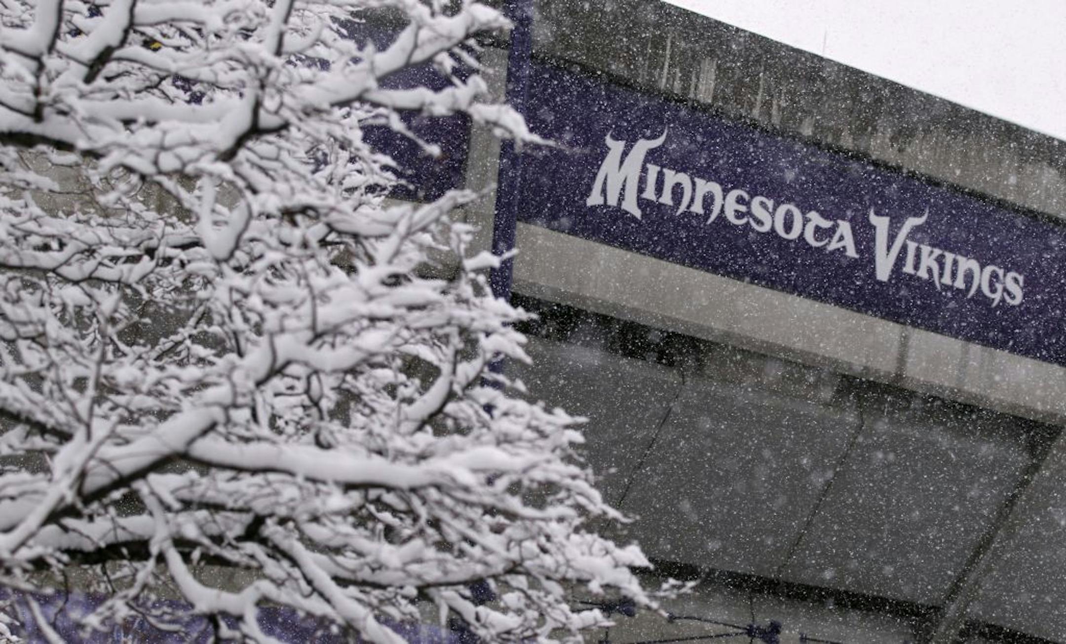 Snow covered trees are seen outside the Mall of America Field at the Hubert H. Humphrey Metrodome before an NFL football game between the Minnesota Vikings and the Chicago Bears, Sunday, Dec. 9, 2012, in Minneapolis.