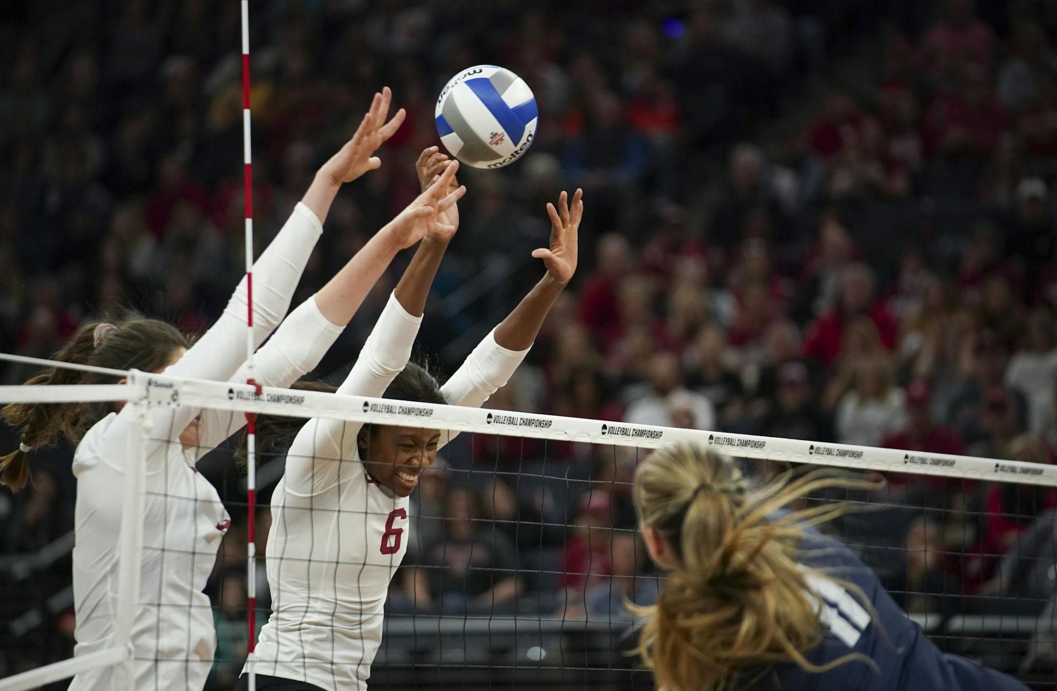 Standord's Audriana Fitzmorris and Tami Alade (6) blocked a shot by BYU's Lacy Haddock in the third set.