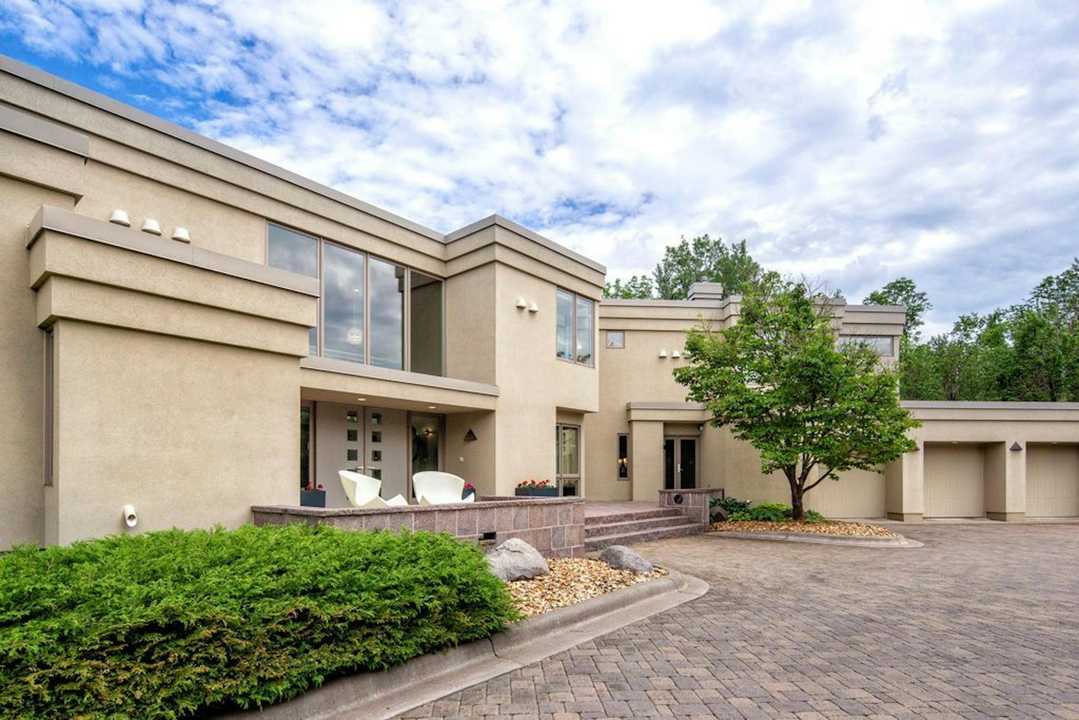 The house has a large circle driveway.