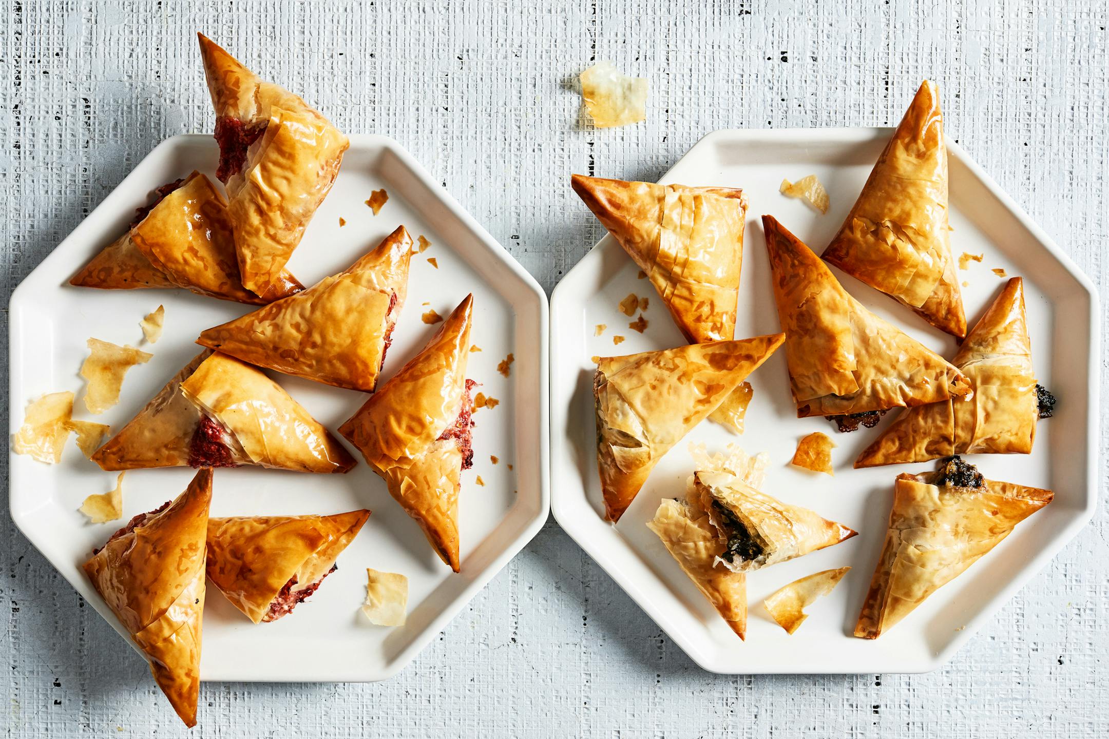 Spring greens and herbed cheese phyllo triangles and creamy roasted and strawberry phyllo triangles. MUST CREDIT: Photo by Stacy Zarin Goldberg for The Washington Post ORG XMIT: 138.0.273629288