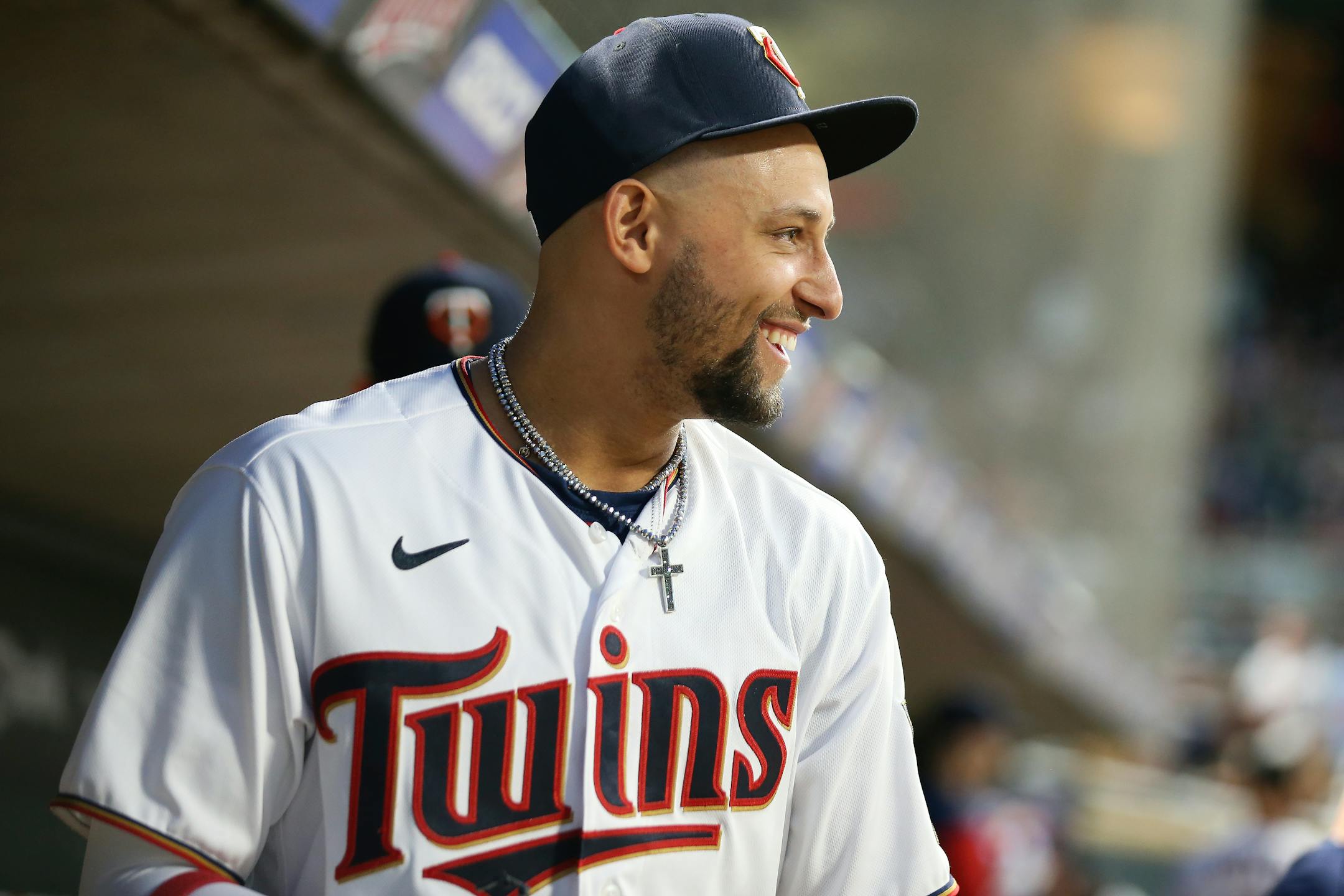 Minnesota Twins shortstop Royce Lewis smiles in the dugout during the third inning of a baseball game against the Oakland Athletics, Friday, May 6, 2022, in Minneapolis. (AP Photo/Stacy Bengs)