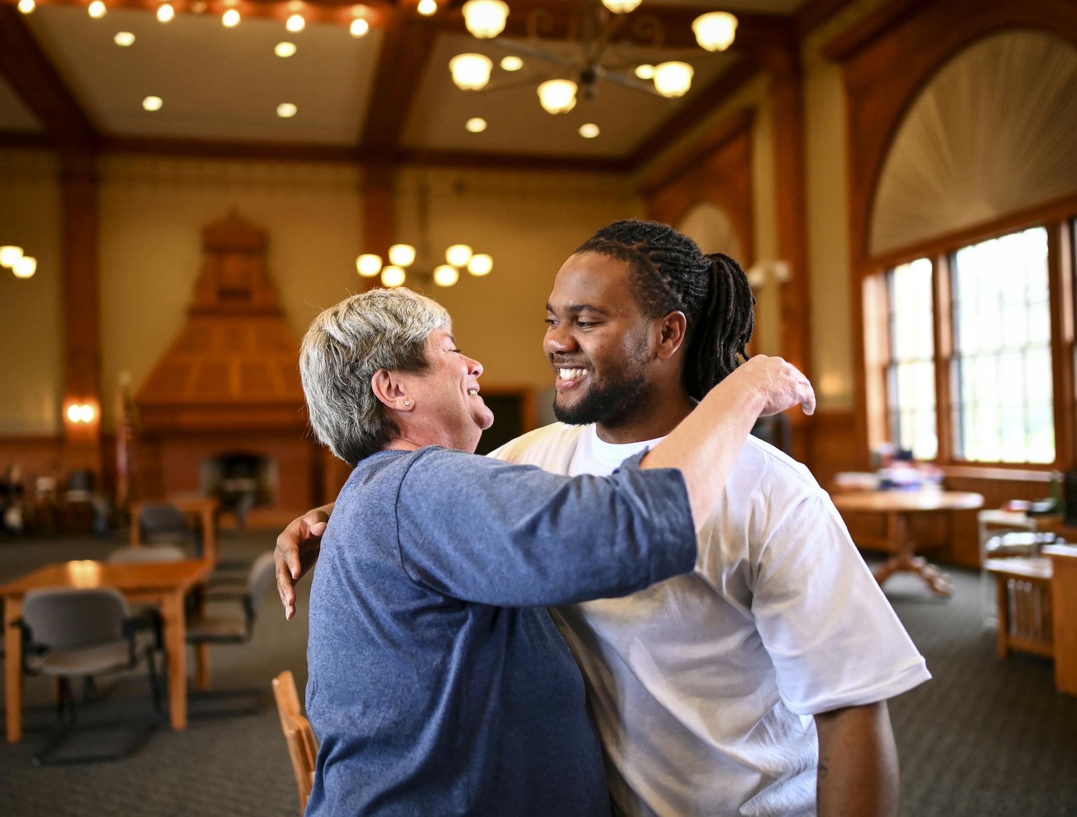 Susan Gethin shared an embrace with Norman Irving as they arrived in the visitation area at the state prison in Red Wing. ] Aaron Lavinsky ¥ aaron.lavinsky@startribune.com Susan Gethin, a local good person and activist from South Minneapolis has a friendship with Norman Irving, a young man from the north side now at Red Wing minimum security prison serving time for an armed-robbery ending with someone being shot. Susan has known Norman for many, many years through her non-profit work and ha