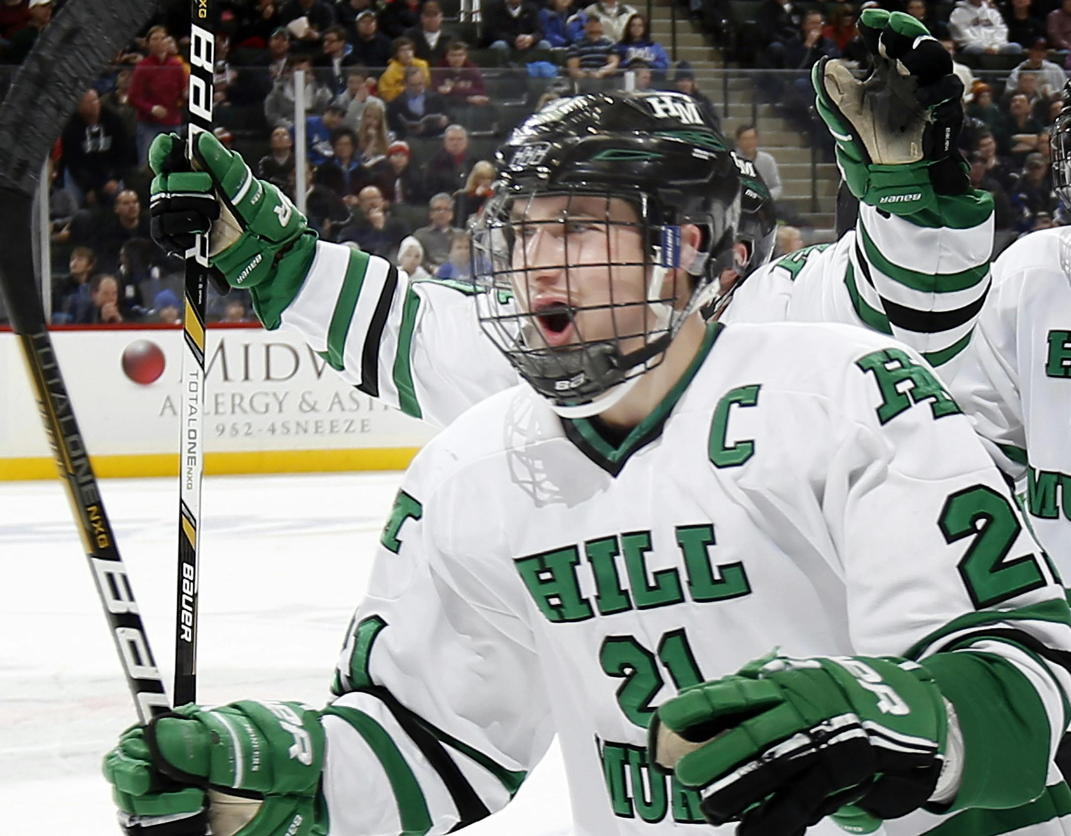 Zach LaValle (21) of Hill Murray celebrated as he skated back to the bench after scoring a goal in the first period. ] CARLOS GONZALEZ cgonzalez@startribune.com - March 7, 2013, St. Paul, Minn., Xcel Energy Center, Minnesota High School Boys State Hockey, Class 2A quarterfinals, Hill Murray vs. Eastview