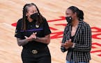 L.A. assistant coach and former Lynx star Seimone Augustus greeted fellow former Lynx star Rebekkah Brunson. Both will have their jerseys retired by t