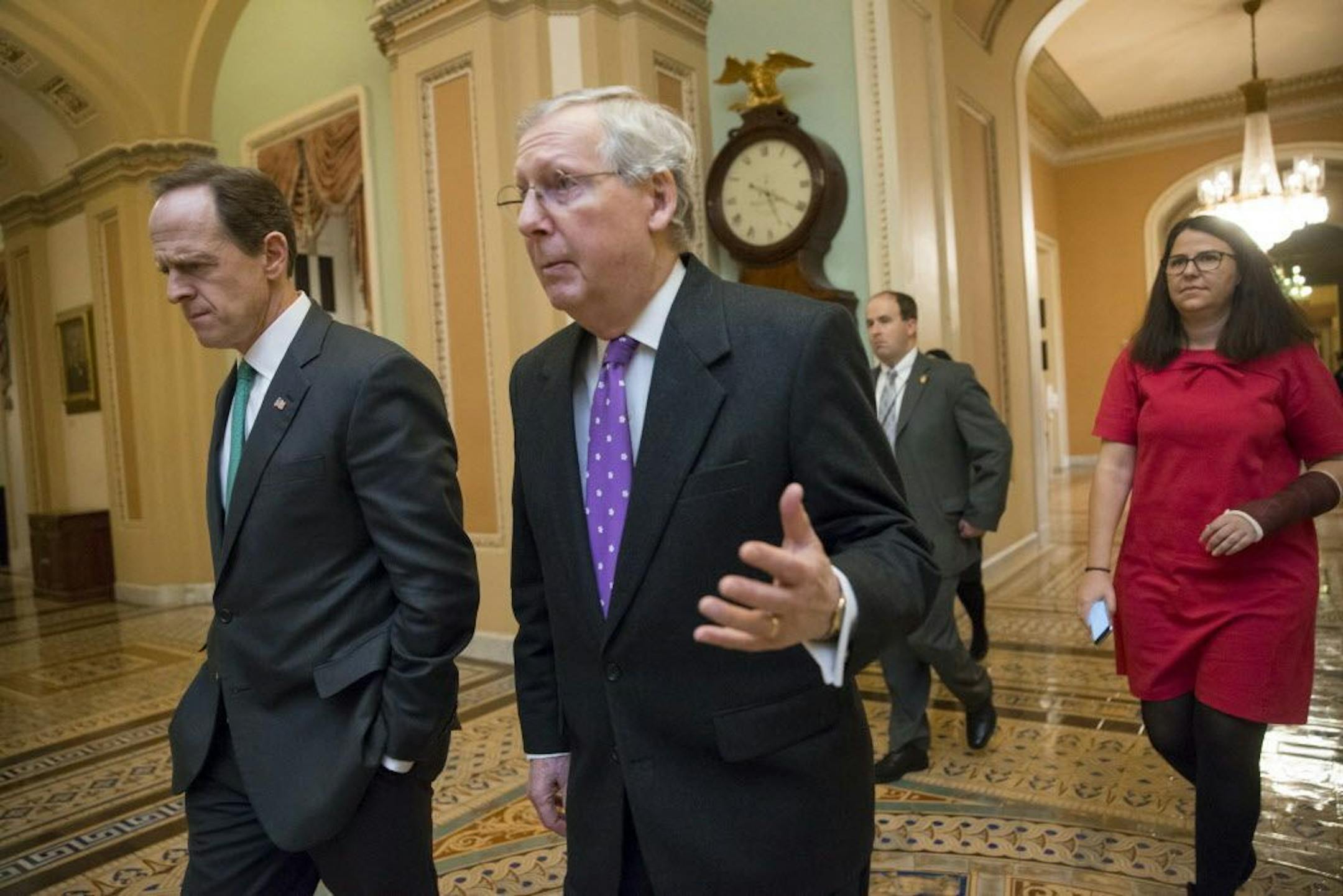 Sen. Pat Toomey, R-Pa., left, and Senate Majority Leader Mitch McConnell, R-Ky., center, are united in saying that the Senate will reject any Supreme Court nominee put forth by President Obama.