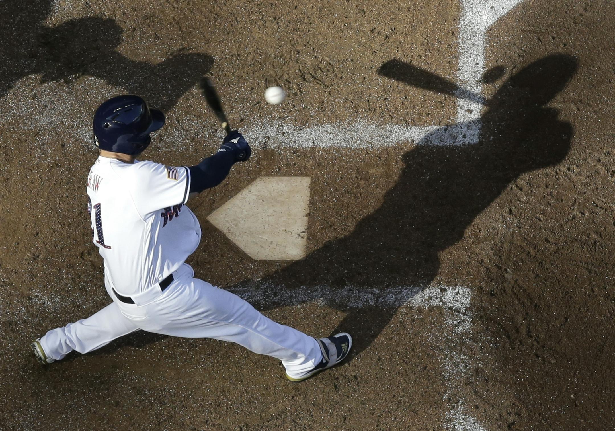 Milwaukee Brewers' Travis Shaw hits a double during the fifth inning of a baseball game against the Minnesota Twins Tuesday, July 3, 2018, in Milwaukee.