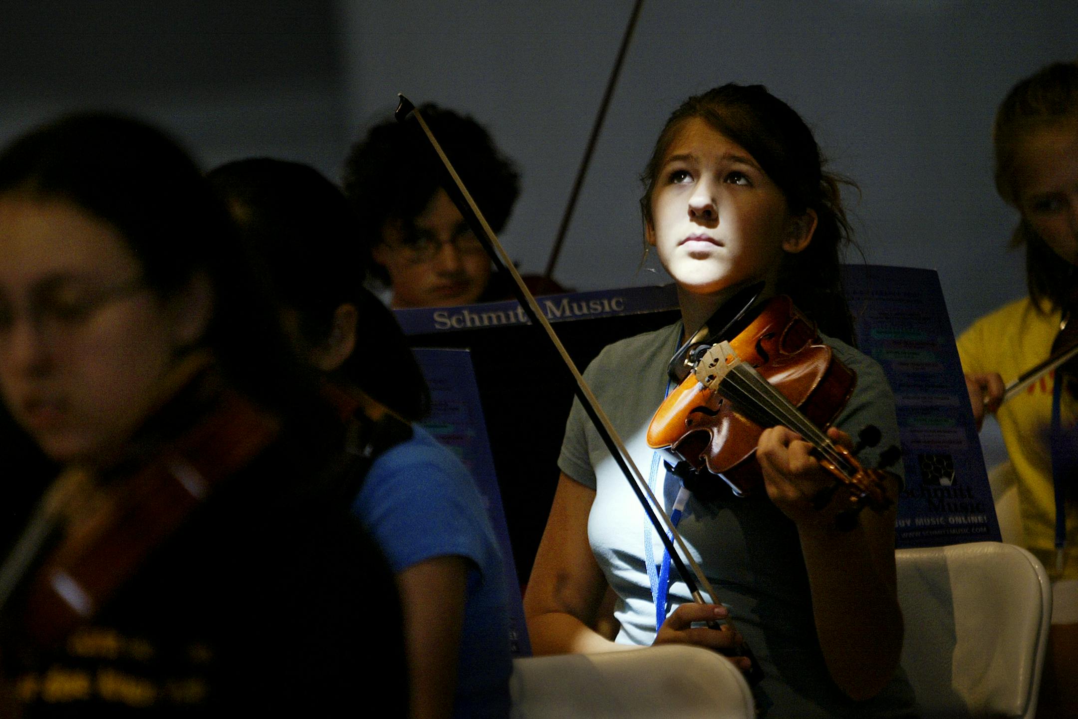 Allegro Orchestra Camp participant Becca Hanson, 14, from Minnetonka, takes a break during a practice session at Wayzata Community Church Monday, June 19, 2006. Jeffrey Thompson &#xd4; jthompson@startribune.com
GENERAL INFORMATION: William Stuber of Shakopee is the artistic director and conductor of a popular summer music camp for kids. The two-week camp runs from June 19 to 29 at a church in Wayzata, where there are three orchestras. He's built the Allegro Orchestra Camp from the ground up, and