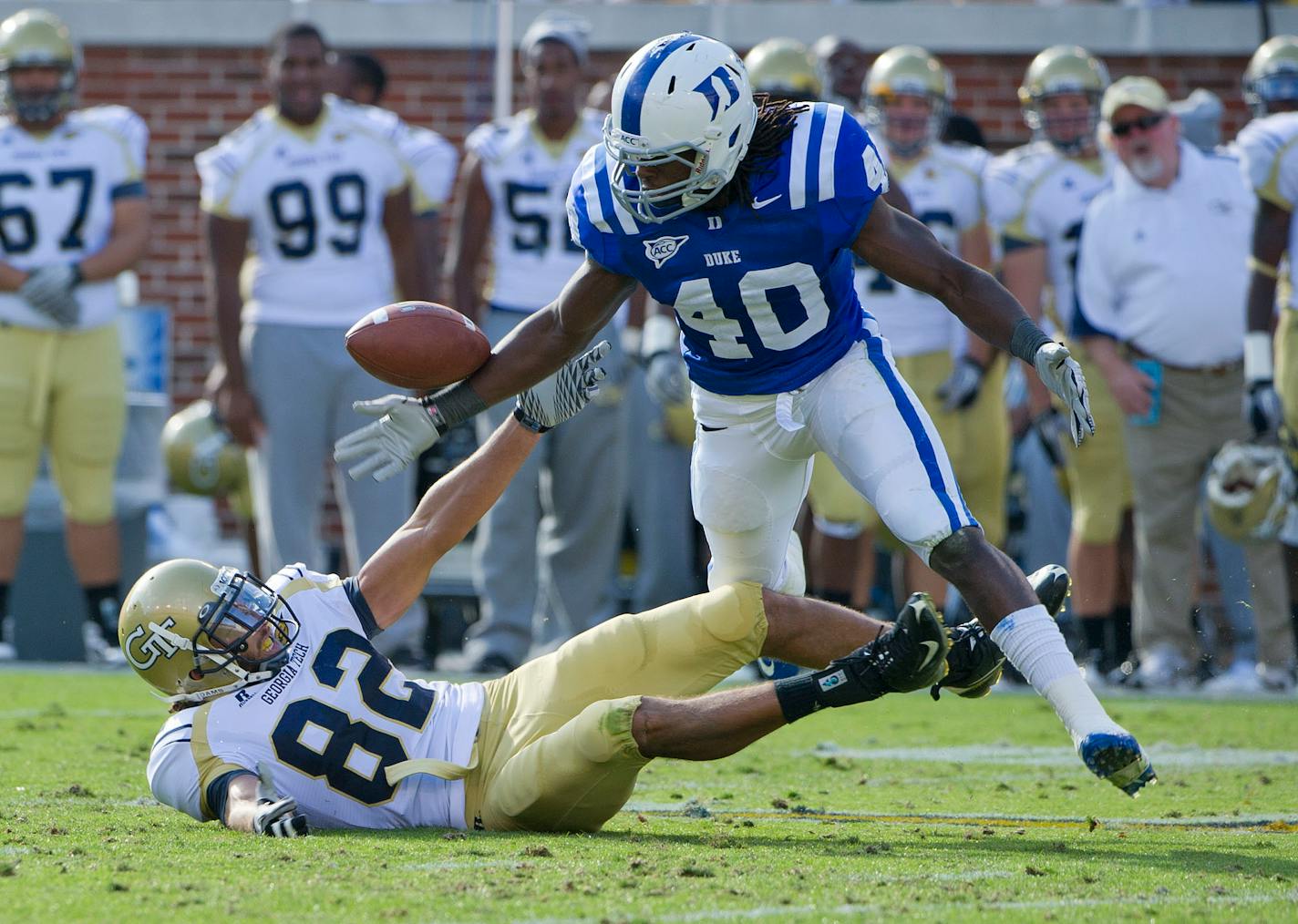 Georgia Tech wide receiver Kevin Cone (82) tries to hang on to a pass broken up by Duke safety Matt Daniels (40) during the first half of an NCAA college football game in Atlanta, Ga., Saturday, Nov. 20, 2010. ( AP Photo/Rich Addicks)