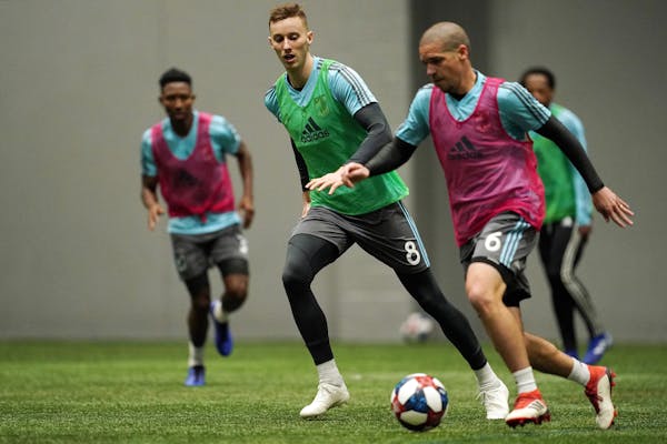 Newly acquired Jan Gregus chased after Ozzie Alonso as he dribbled the ball up the field in Minnesota United's training session Jan. 22 at its practic