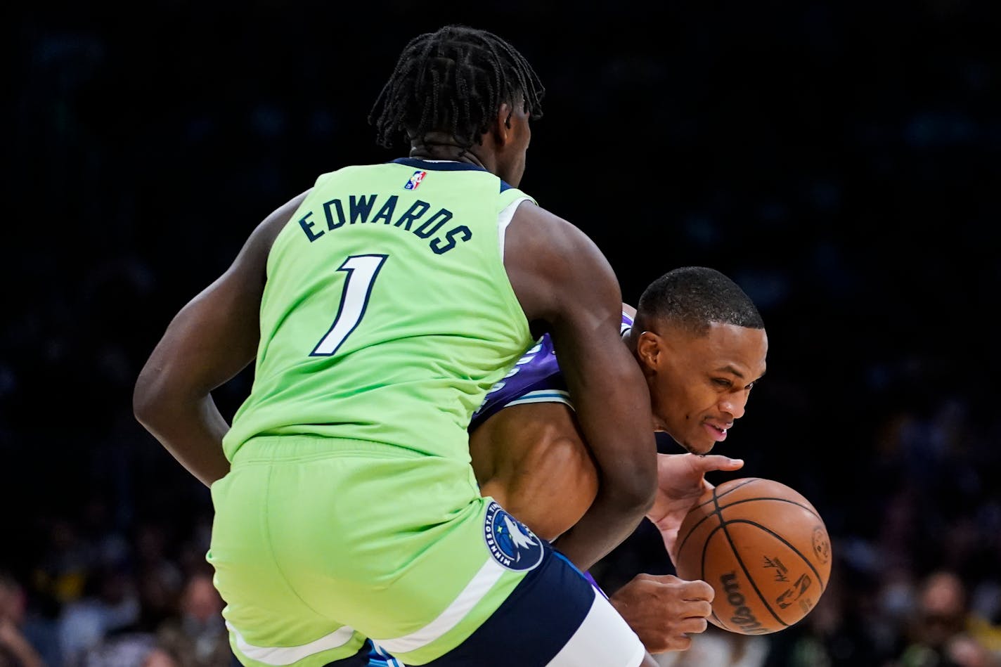 Los Angeles Lakers' Russell Westbrook is defended by Minnesota Timberwolves' Anthony Edwards during the first half of an NBA basketball game Friday, Nov. 12, 2021, in Los Angeles. (AP Photo/Jae C. Hong)