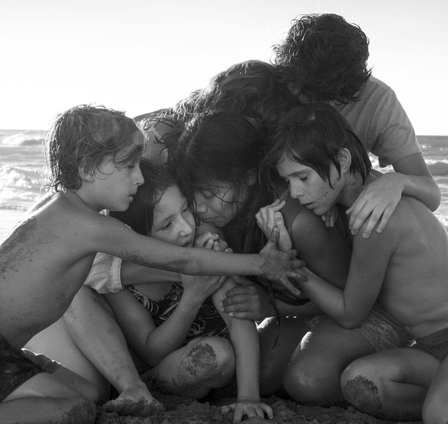 This image released by Netflix shows Yalitza Aparicio, center, in a scene from the film "Roma," by filmmaker Alfonso Cuaron. (Carlos Somonte/Netflix via AP)