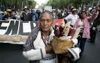 Mexican farmers protest the end of import protections for their country's corn and bean crops in Mexico City, Wednesday, Jan. 2, 2008. Corn, beans, su