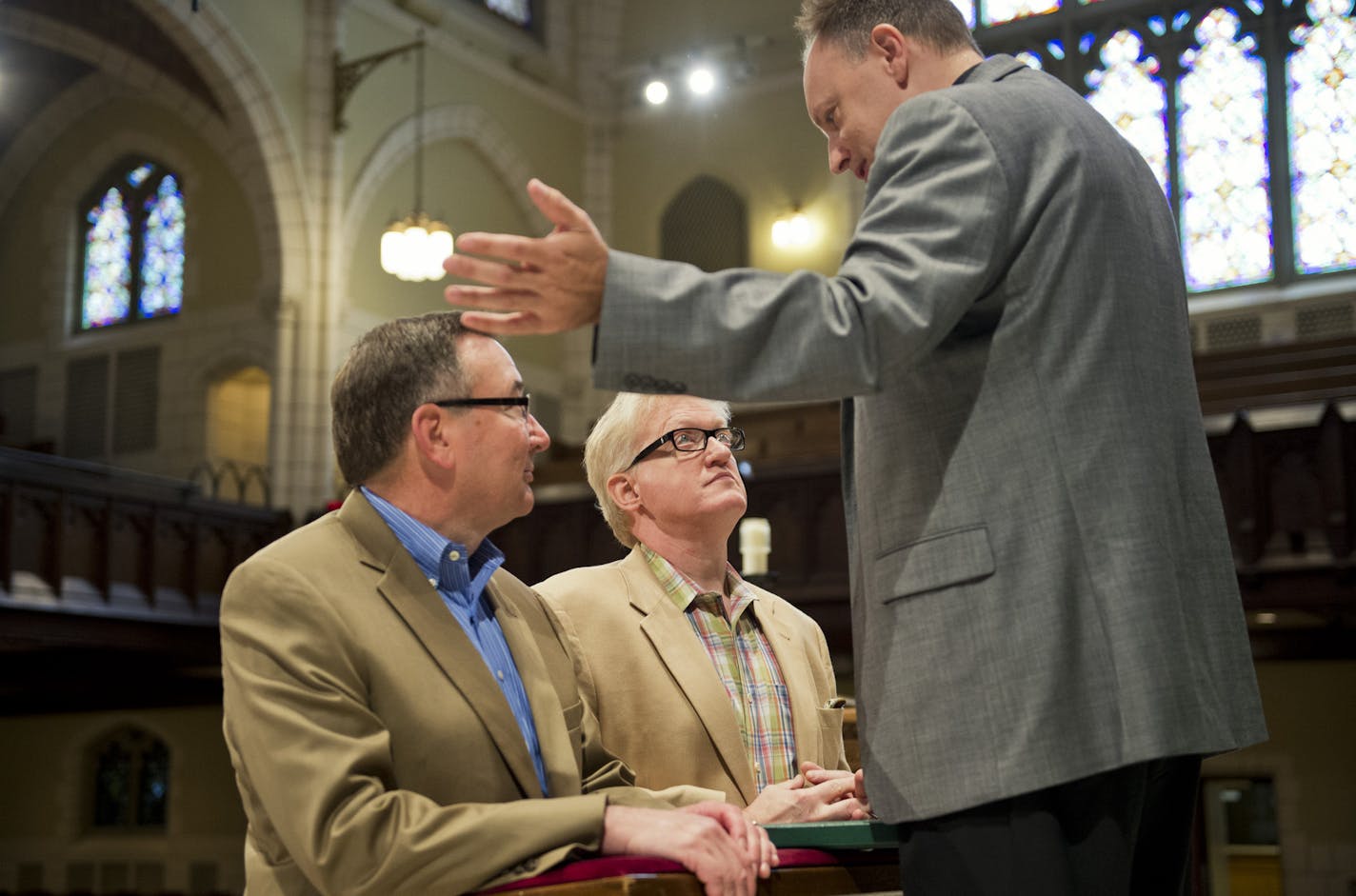 Karl Starr and Christopher Haug met with the Rev. D. Foy Christopherson to run through their wedding ceremony. They will be married by Christopherson at Central Lutheran Church in Minneapolis. At top, the couple had rings made for their commitment ceremony 20 years ago.