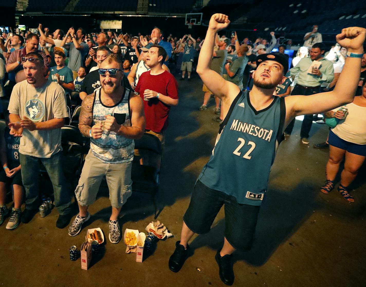 Joshua Hill, 34, (right) of Minneapolis celebrated after the Timberwolves selected Kris Dunn with 5th pick of the draft. ] CARLOS GONZALEZ cgonzalez@startribune.com - June 23, 2016, Minneapolis, MN, Target Center, NBA Draft Party, Minnesota Timberwolves