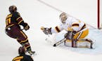 Minnesota goaltender Jared Moe (31) made a glove save off a shot by Arizona State forward Benji Eckerle (11) in the second period. ] ANTHONY SOUFFLE �