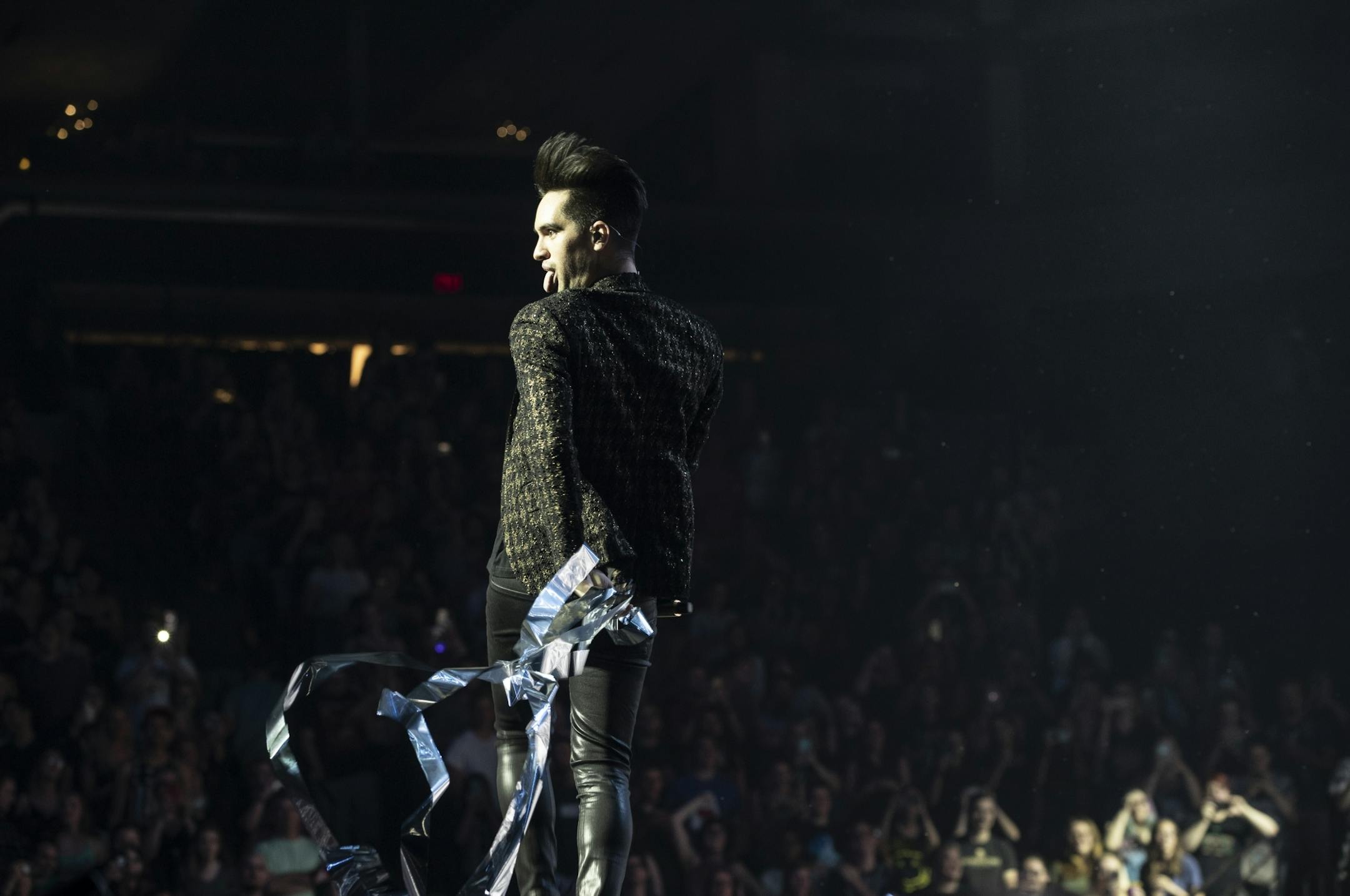 Brendon Urie, lead singer of Panic! at the Disco, stuck out his tongue in a playful moment as he performed at the Target Center in Minneapolis, Minn., on July 11, 2018.