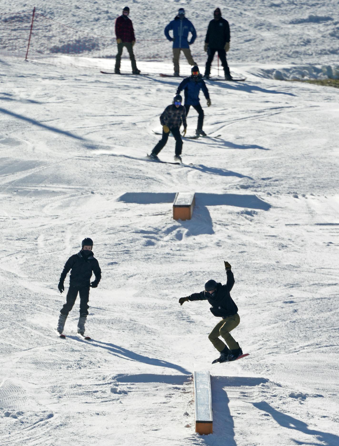 Skiers and boarders at Afton Alps enjoyed mild weather and a base of man-made snow Friday.