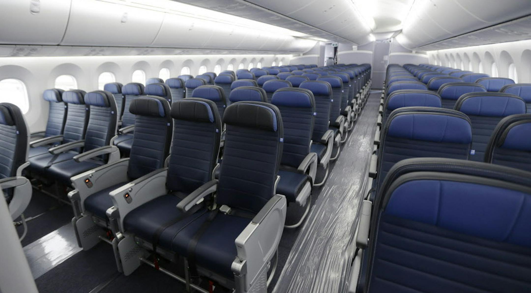 FILE - In this Jan. 26, 2016, file photo, economy class seating is shown on a new United Airlines Boeing 787-9 undergoing final configuration and maintenance work at Seattle-Tacoma International Airport in Seattle. The Senate refused April 7 to come to the aid of airline passengers squeezed by the ever-shrinking size of their seats. An amendment by Sen. Chuck Schumer, D-N.Y., would have blocked airlines from further reducing the "size, width, padding, and pitch" of seats, passengers' legroom and
