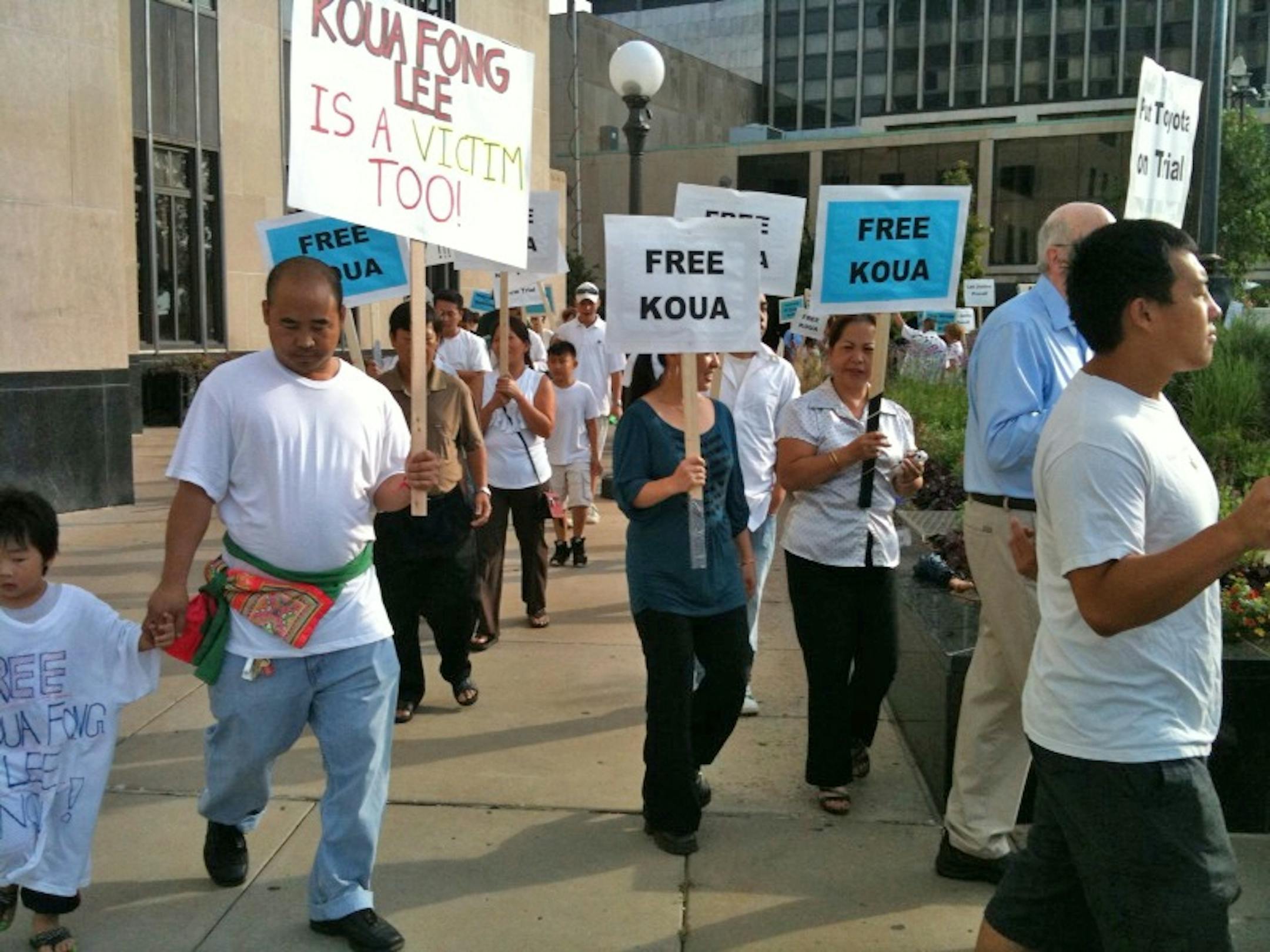 Koua Lee's supporters rallied Monday outside the Ramsey County courthouse,