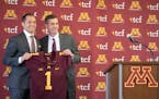 Newly named University of Minnesota football coach P.J. Fleck and athletic director Mark Coyle held up Fleck's jersey during a press conference Friday