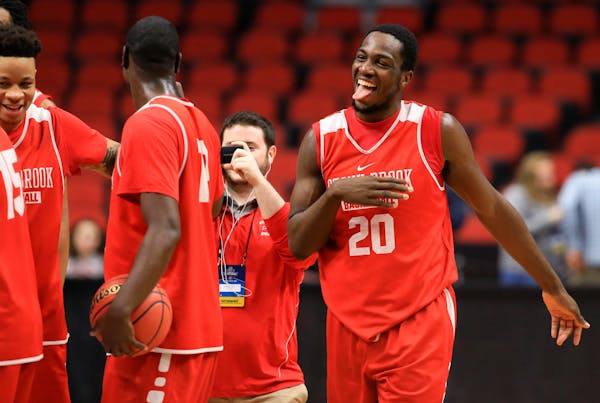 Stony Brook's Jameel Warney (20) has a light moment during practice in Des Moines.
