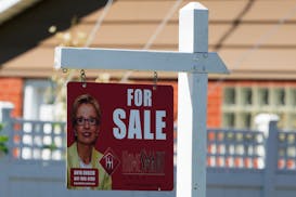 A for sale sign stands outside a residence in Niles, Ill., Monday, July 1, 2024.