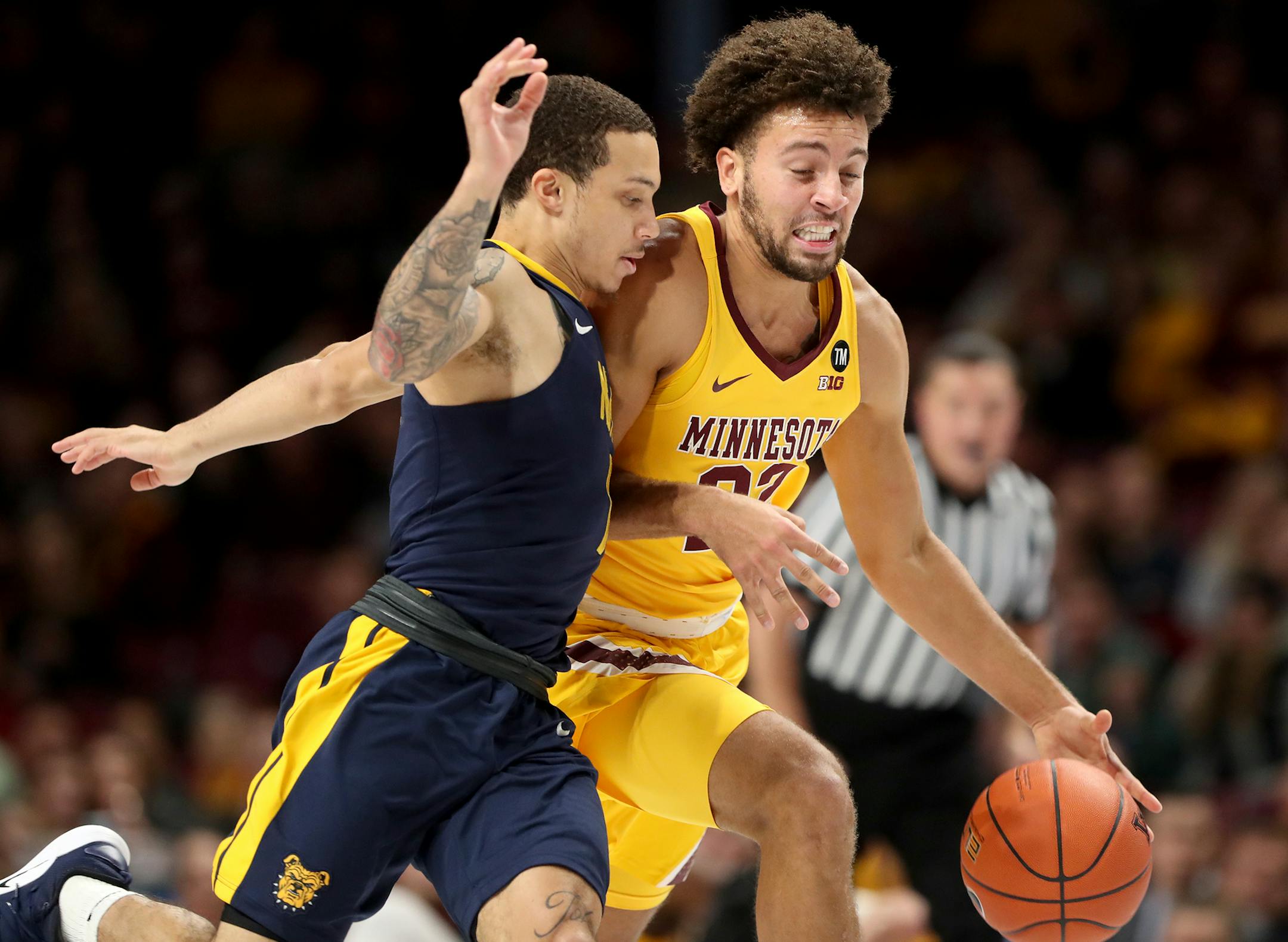 The University of Minnesota's Gabe Kalscheur (22) heads up court after stealing the ball from North Carolina A&T's Aaren Edmead (1) during the first half Friday, Dec. 21, 2018, at Williams Arena in Minneapolis, MN. The Gophers beat NC A&T 86-67.] DAVID JOLES • david.joles@startribune.com Gophers vs. North Carolina A&T