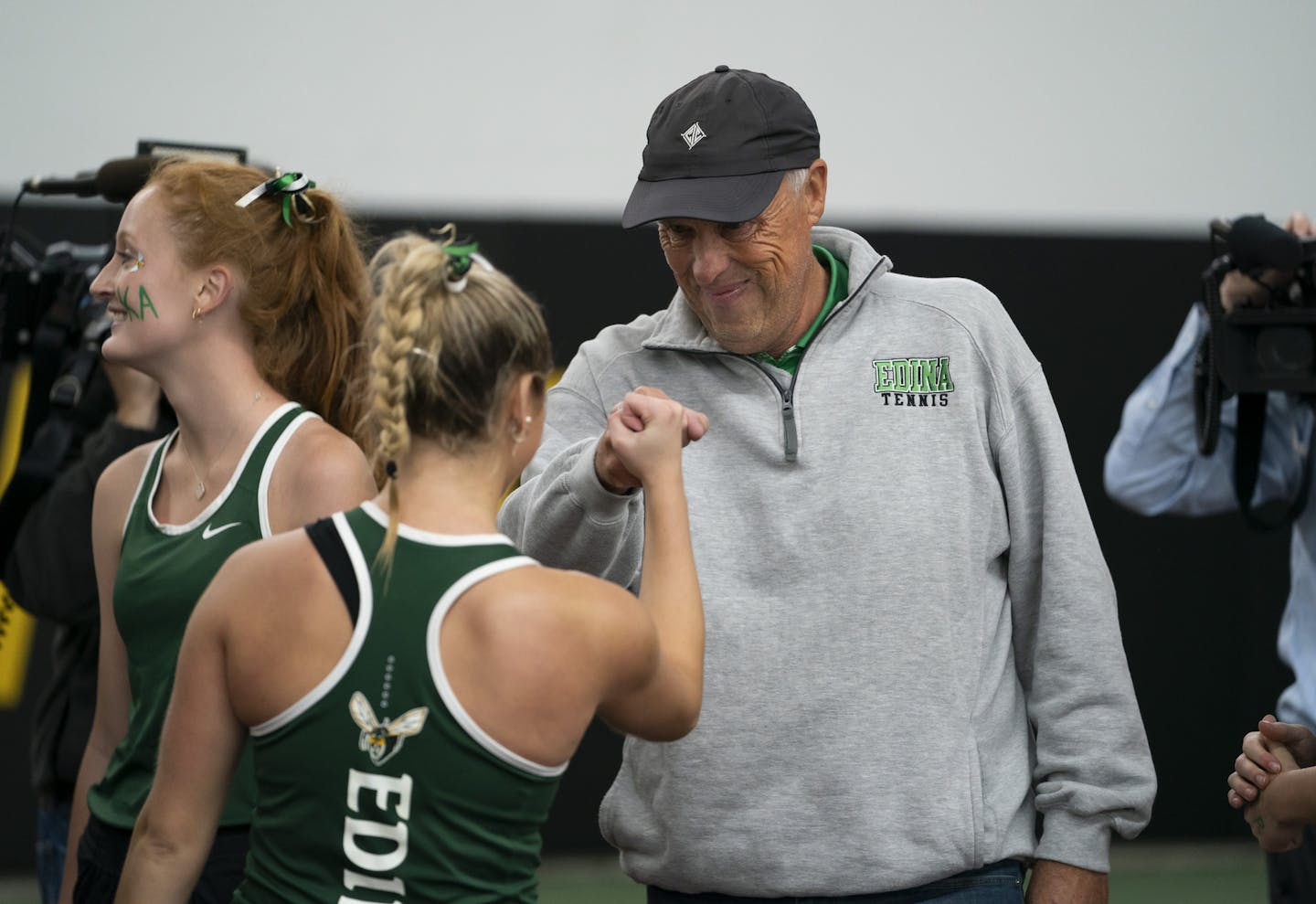 Edina head coach Steve Paulsen fist-bumped first singles player Nicole Copeland after Edina won the Class AA title last fall.