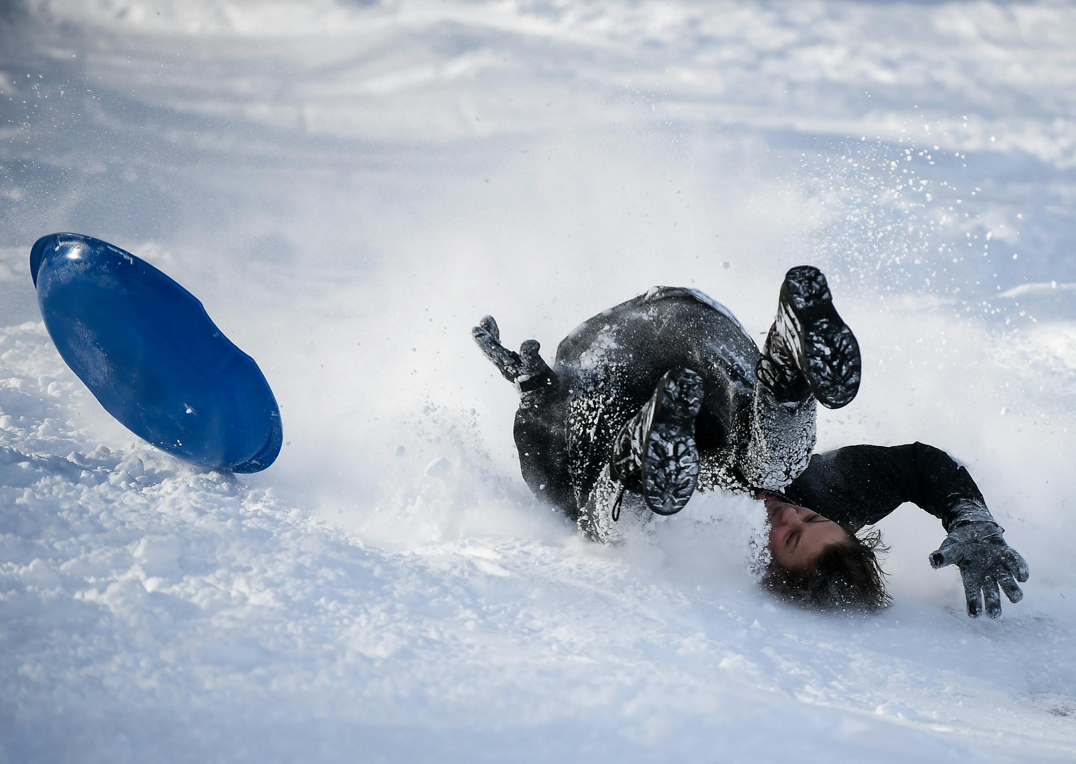 Bobby Wiesner, 15, a student at Southwest High School, was upended as he sledded down the hill at Beard's Plaisance Tuesday. ] AARON LAVINSKY ï aaron.lavinsky@startribune.com The aftermath of Monday's snowstorm was photographed Tuesday, Jan. 23, 2018 at Beard's Plaisance in Minneapolis, Minn.