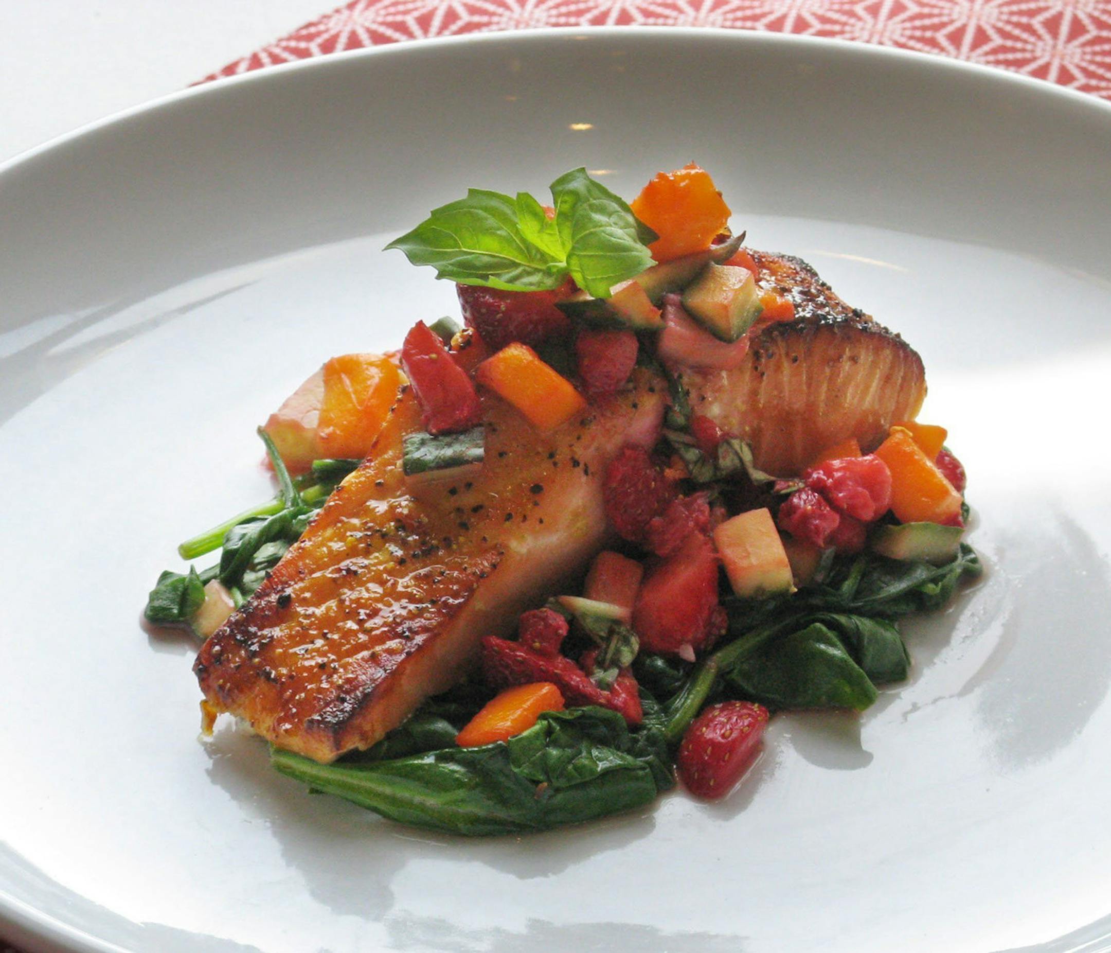 Salmon pairs well with strawberry salsa and spicy spinach. (Susan M. Selasky/Detroit Free Press/MCT) ORG XMIT: 1140383