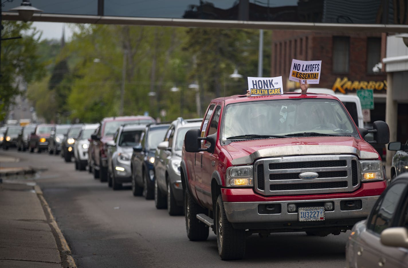 Around 50 vehicles drove down E Fourth St. in Duluth, MN as they participated in a caravan protesting the layoffs of healthcare workers by Essentia Health. ] ALEX KORMANN • alex.kormann@startribune.com Around 50 vehicles participated in a caravan protesting the layoffs of healthcare workers by Essentia Health. The caravan snaked around downtown and made multiple passes around the Essentia campus in Duluth, MN on June 1, 2020.