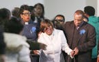 Irma Burns, mother of Jamar Clark, was escorted from her son's casket during funeral services at Shiloh Temple International Ministries Wednesday, Nov