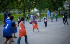 A few dozen neighborhood kids took part in a summer basketball program with plainclothes officers near St. Cloud’s COP House in June 2018. Waite Par