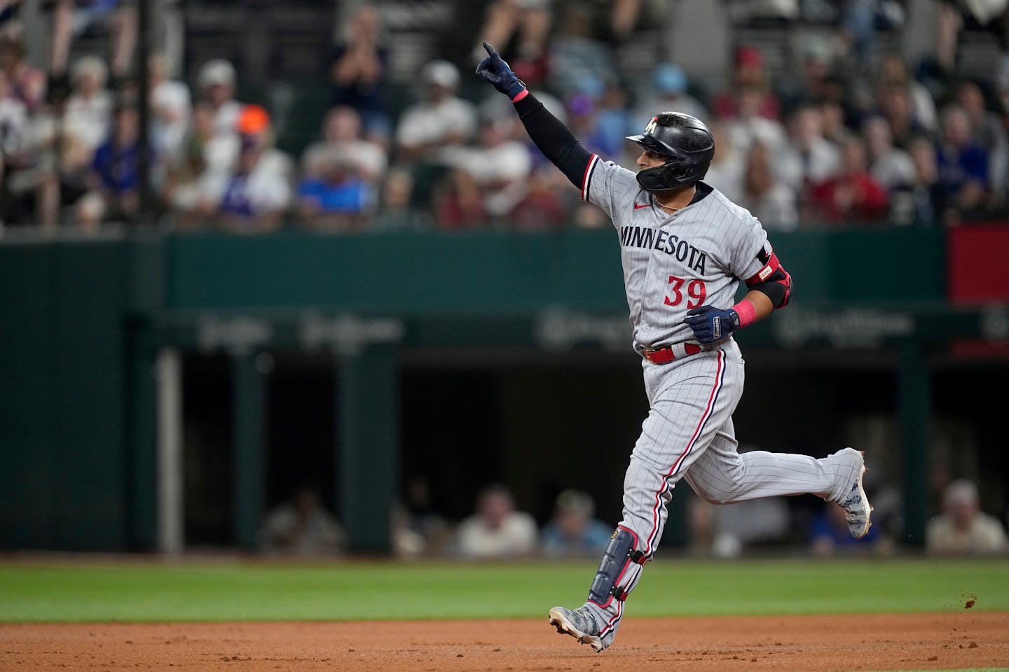 Donovan Solano celebrated after his solo home run in the third inning against the Rangers on Saturday.