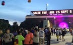 Friday's Minnesota State Fair attendance set a second-day record, with 141,023 people flocking to the fairgrounds, some to honor Prince.