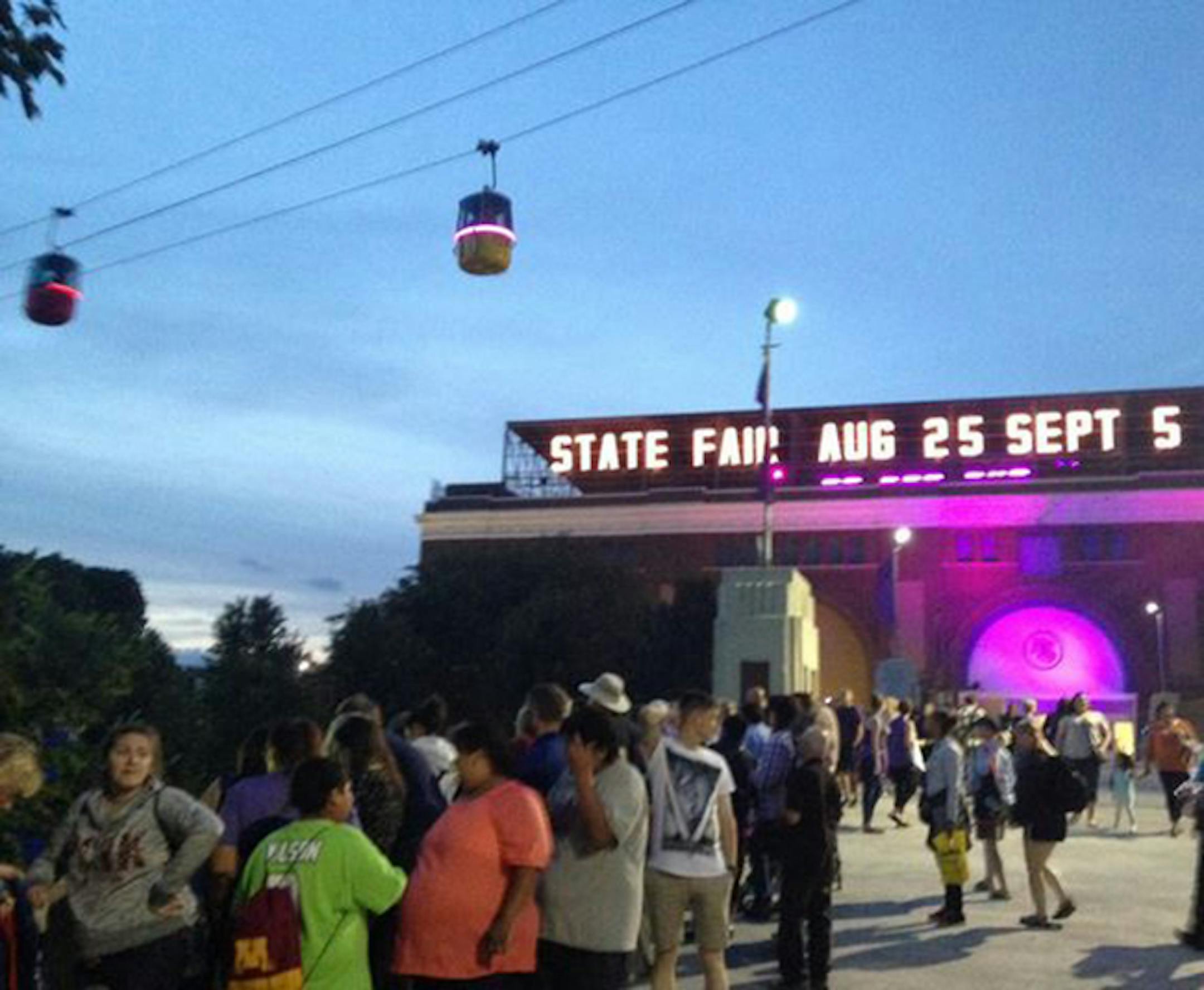 Friday's Minnesota State Fair attendance set a second-day record, with 141,023 people flocking to the fairgrounds, some to honor Prince.