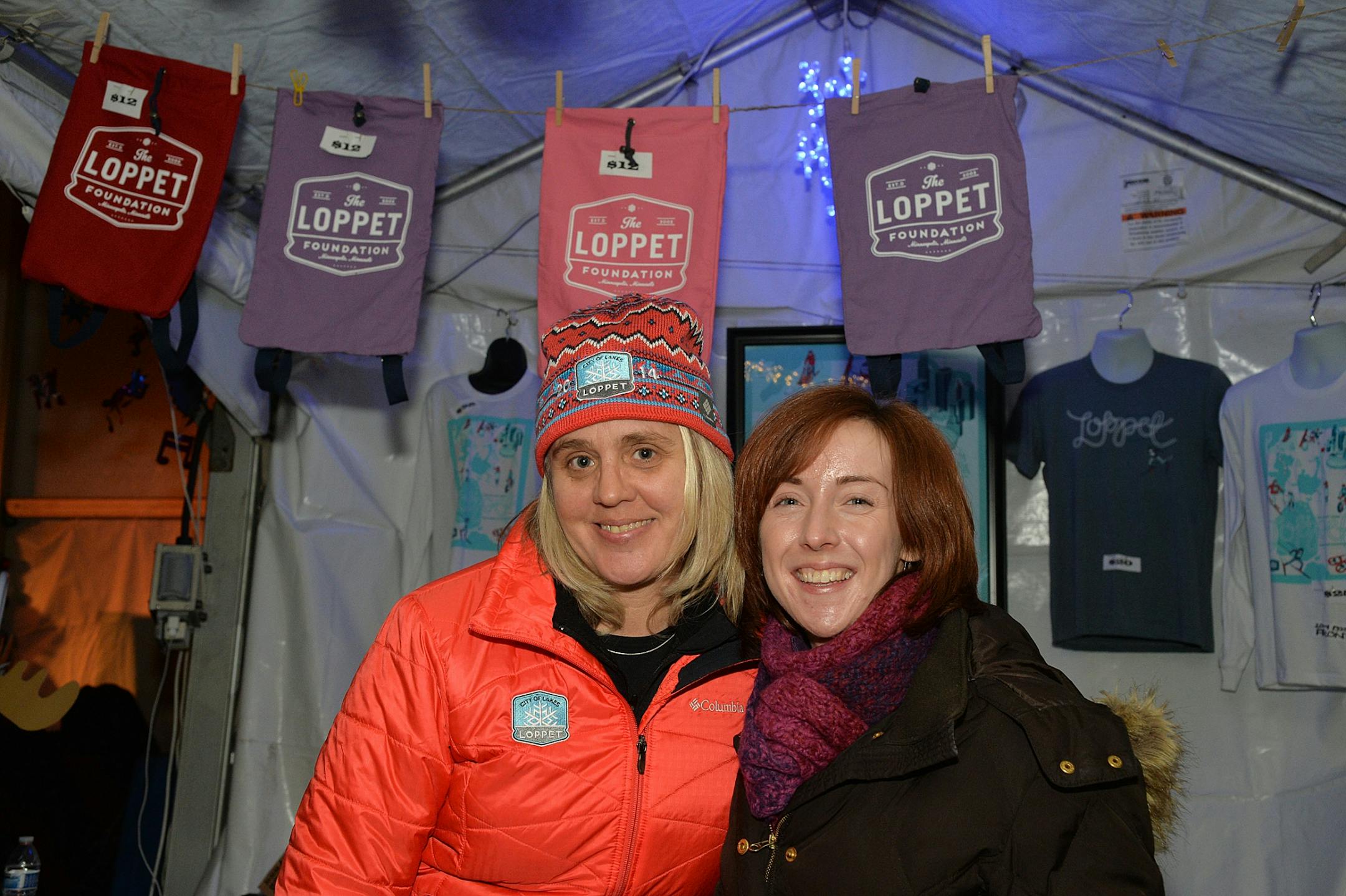 Volunteers Heidi Erickson (left) and Laura Bolstad sold Loppet merchandise in the Big Tent.