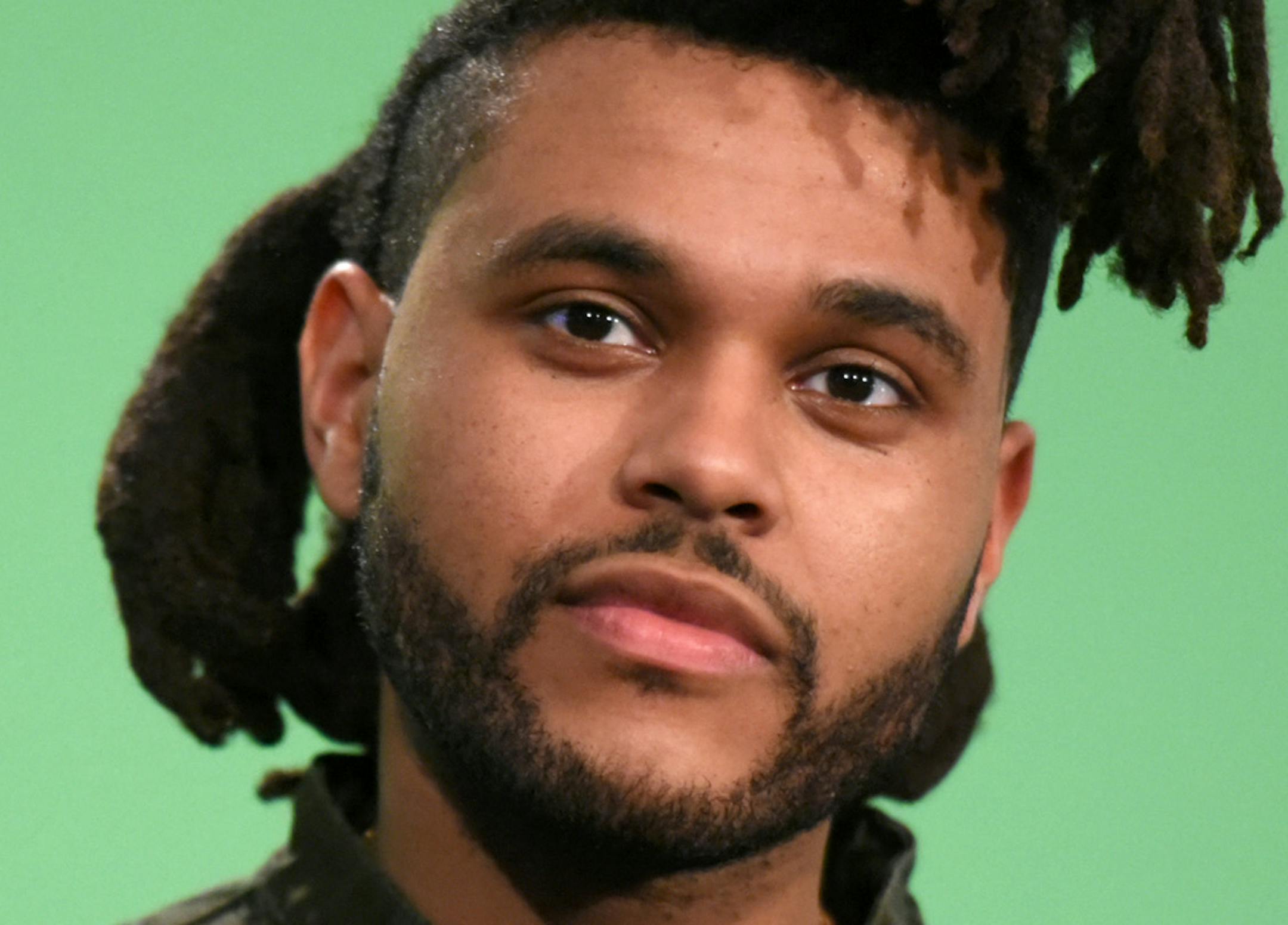 FILE - In this Aug. 30, 2015, file photo, The Weeknd poses in the press room at the MTV Video Music Awards in Los Angeles. Spotify announced its end-of-the-year list Tuesday, Dec. 1, 2015, and said Drake was the most streamed artist of the year globally, earning 1.8 billion streams in 2015. The Weeknd&#xed;s breakout album, &#xec;Beautify Behind the Madness,&#xee; was the most streamed album of the year, beating Drake&#xed;s &#xec;If You&#xed;re Reading This It&#xed;s Too Late,&#xee; which was N