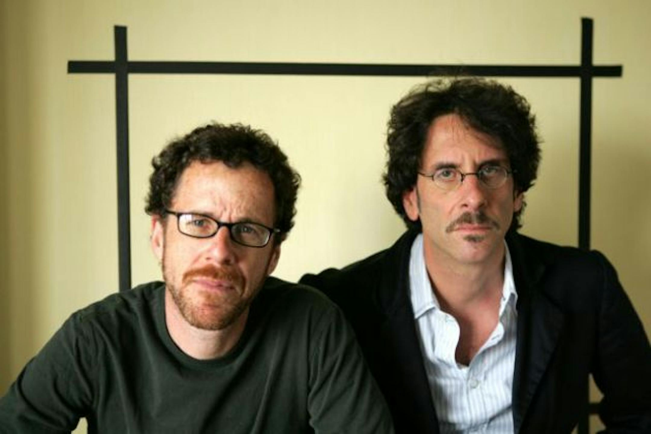 ** FILE ** Filmakers Ethan Coen, left and Joel Coen, pose for a portrait while promoting their new movie "No Country For Old Men," at the Four Seasons Hotel in Los Angeles, in this Nov. 4, 2007, file photo. The Coen brothers earned a nomination Tuesday, Jan. 8, 2008, as best filmmaker from the Directors Guild of America for their bloody crime saga "No Country for Old Men."  (AP Photo/Stefano Paltera, file) ORG XMIT: NYET123