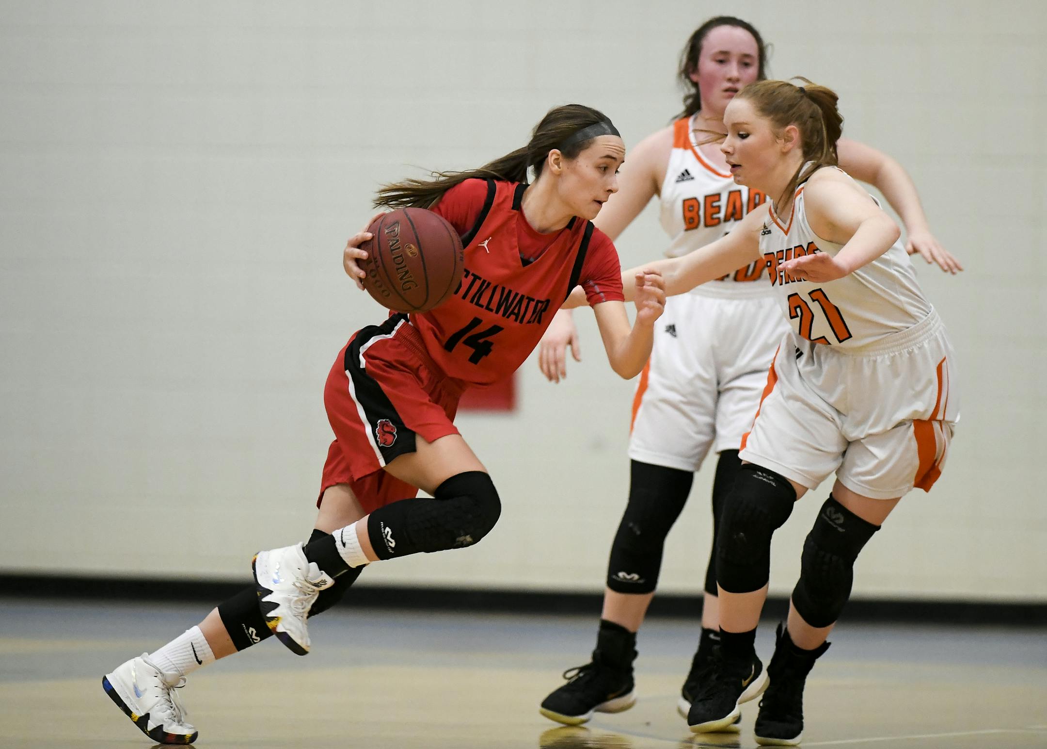 Stillwater guard Sara Scalia drove toward the basket against White Bear Lake guard Ella Janicki.