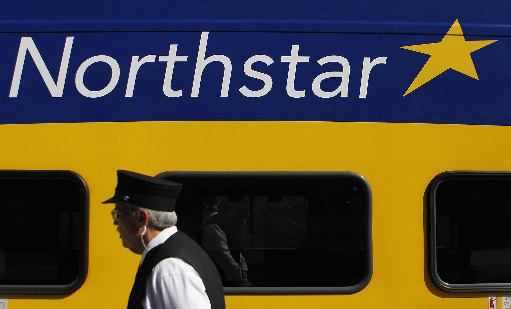Conductor J.R. Long waked by the Northstar Commuter Rail at Target Field on Tuesday. ] CARLOS GONZALEZ ï cgonzalez@startribune.com , July 19, 2011, Target Field, Minneapolis, Minn, MLB, Minnesota Twins vs. Cleveland Indians ORG XMIT: MIN2012101613212730 ORG XMIT: MIN1412181850220249
