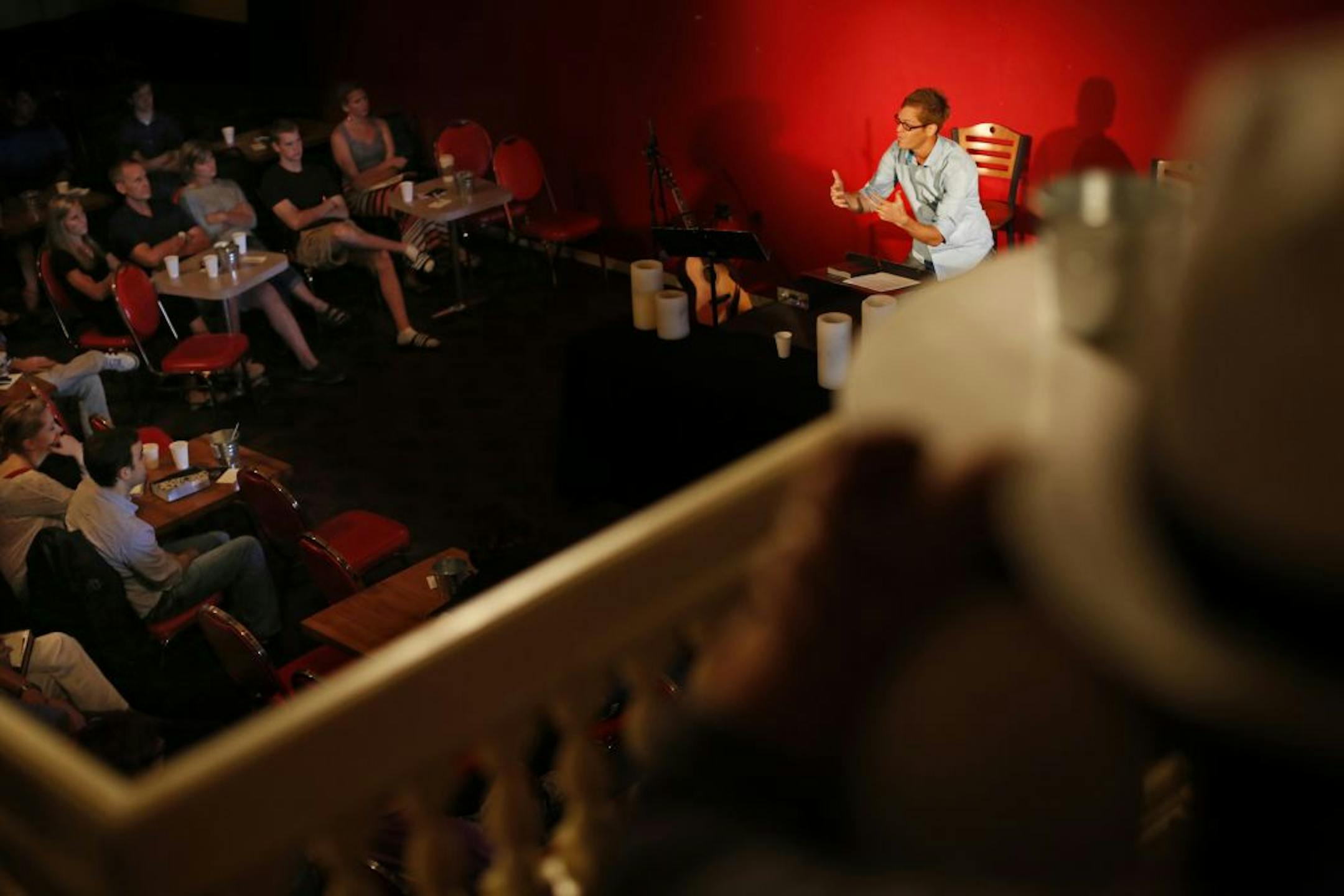 At the Joke Joint in Lilydale, home of Awaken Church, pastor Micah Witham addresses the plus and minuses of fasting with his congregation. Witham feels that the venue is a plus, helping his members relax and let go of preconceived notions of what church should be like .