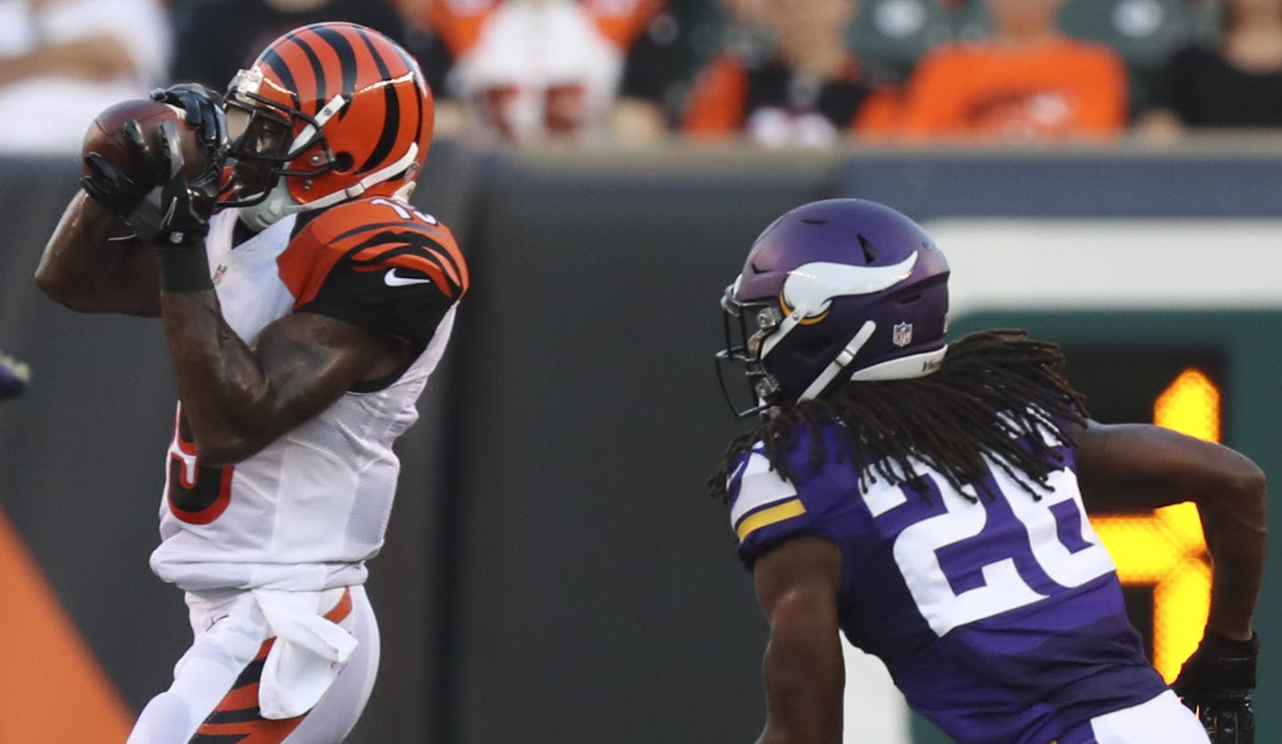 Cincinnati Bengals wide receiver Brandon Tate (19) caught a pass in front of Minnesota Vikings cornerback Trae Waynes (26) for a 20 yard gain and a first quarter first down Friday night in Cincinnati.